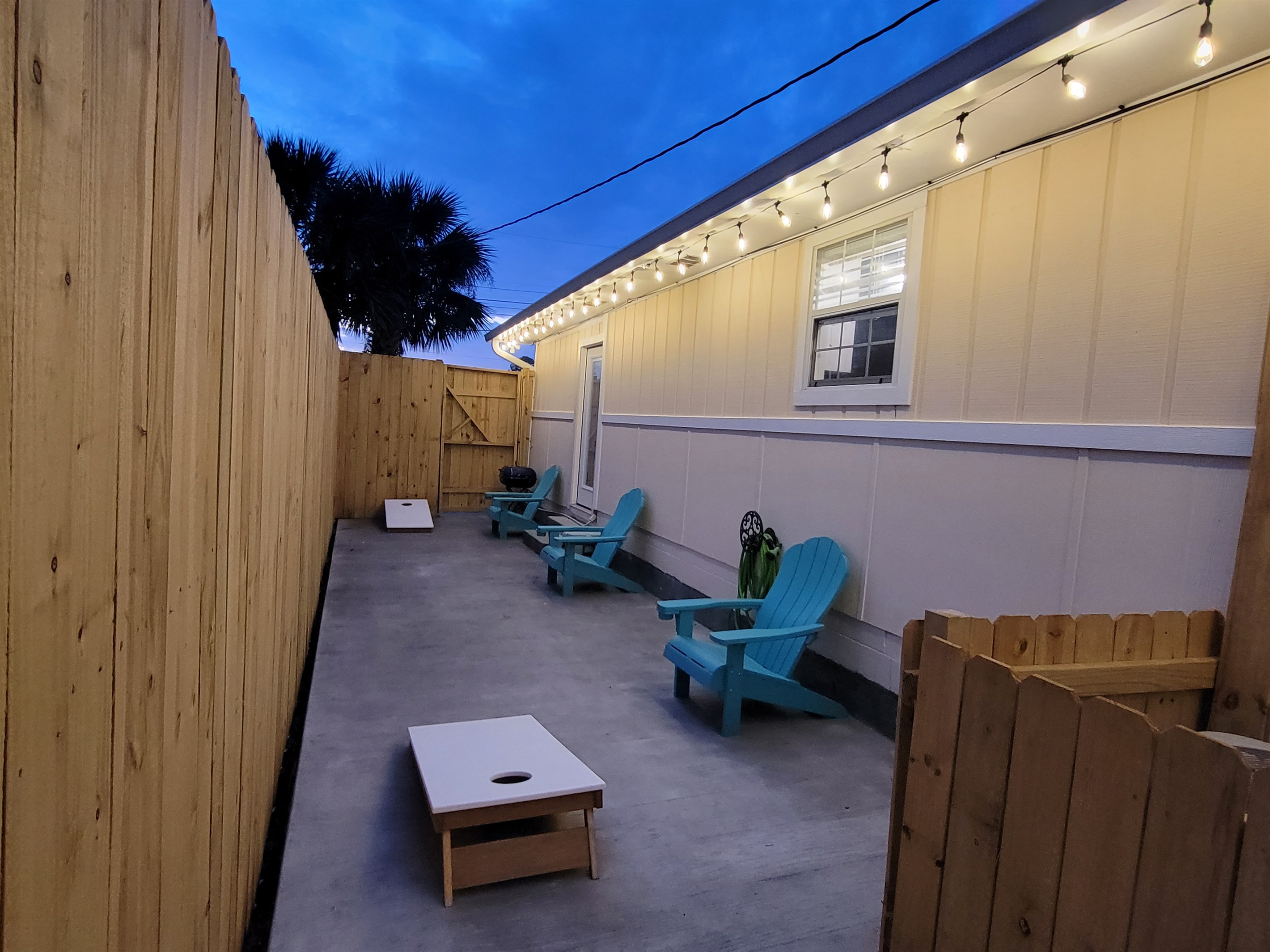 Enjoy a game of cornhole on the beach house patio...