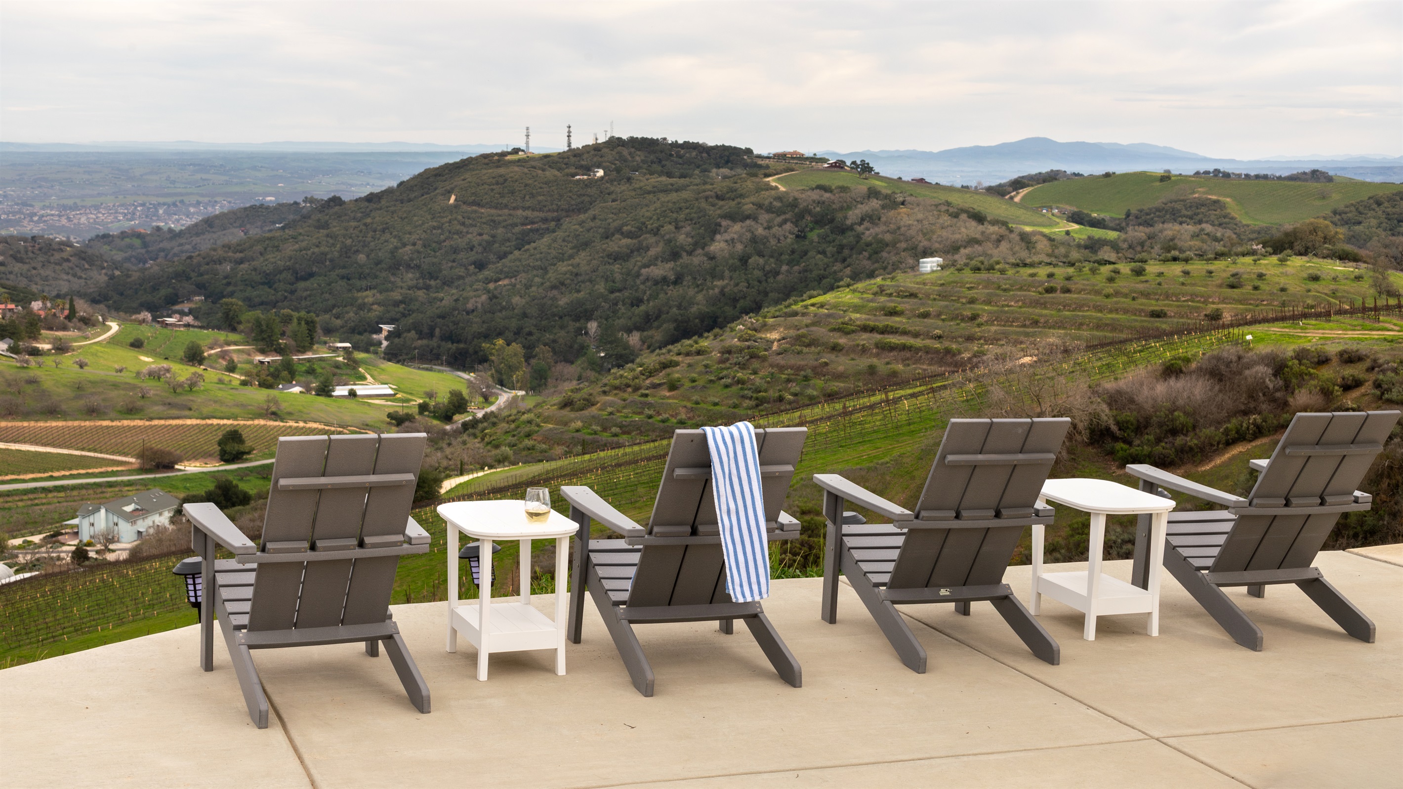 Pull up a chair — or four. The hilltop terrace offers front-row seats to the entire Paso Robles valley, best enjoyed with a glass of white and nowhere to be.