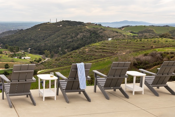 Pull up a chair — or four. The hilltop terrace offers front-row seats to the entire Paso Robles valley, best enjoyed with a glass of white and nowhere to be.
