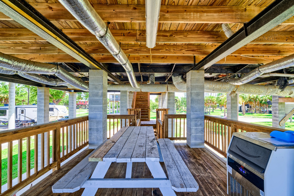 Lower level with picnic table and commercial ice maker