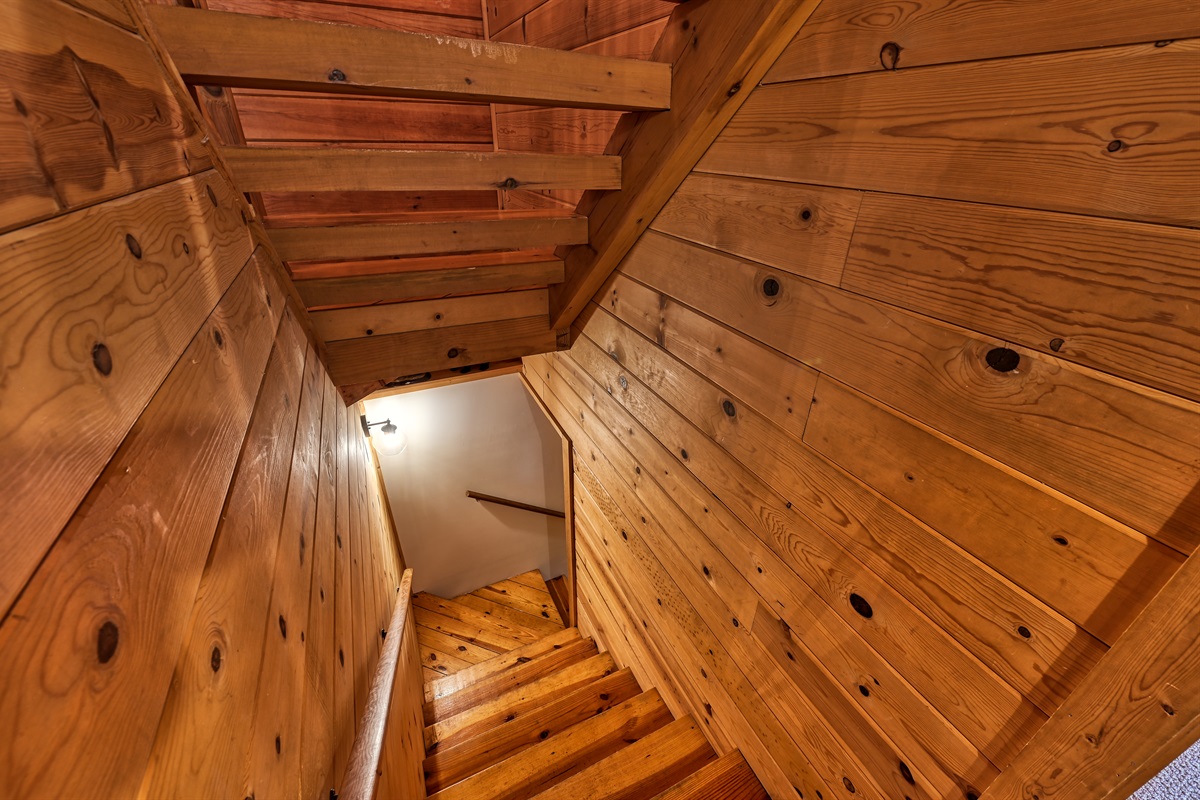 Interior staircase leading to the game room and basement level bedrooms.