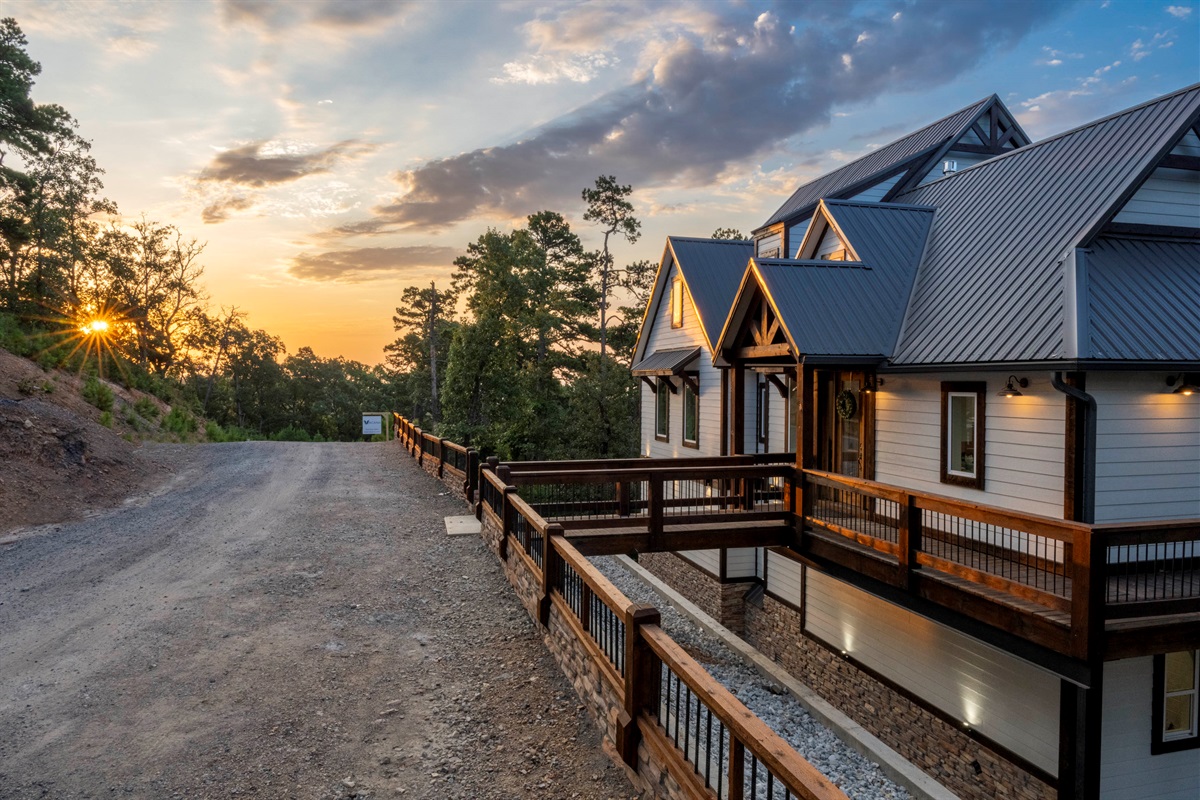 Welcoming cabin entrance with beautiful sunset lighting and rustic charm