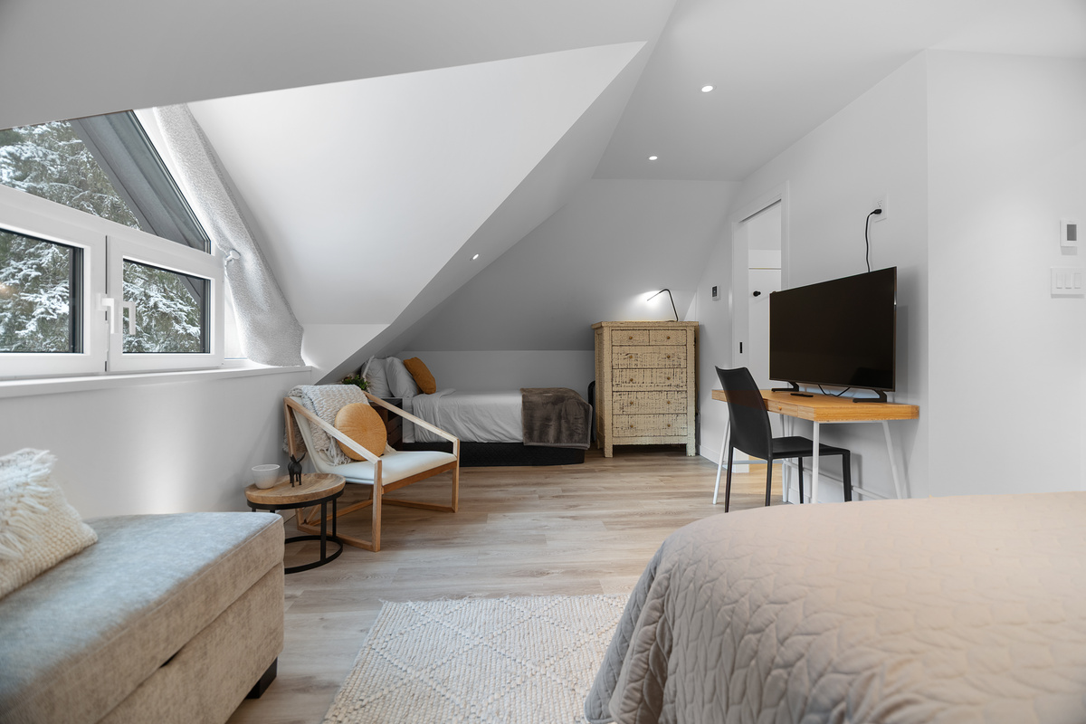 Primary suite with seating, desk and twin nook