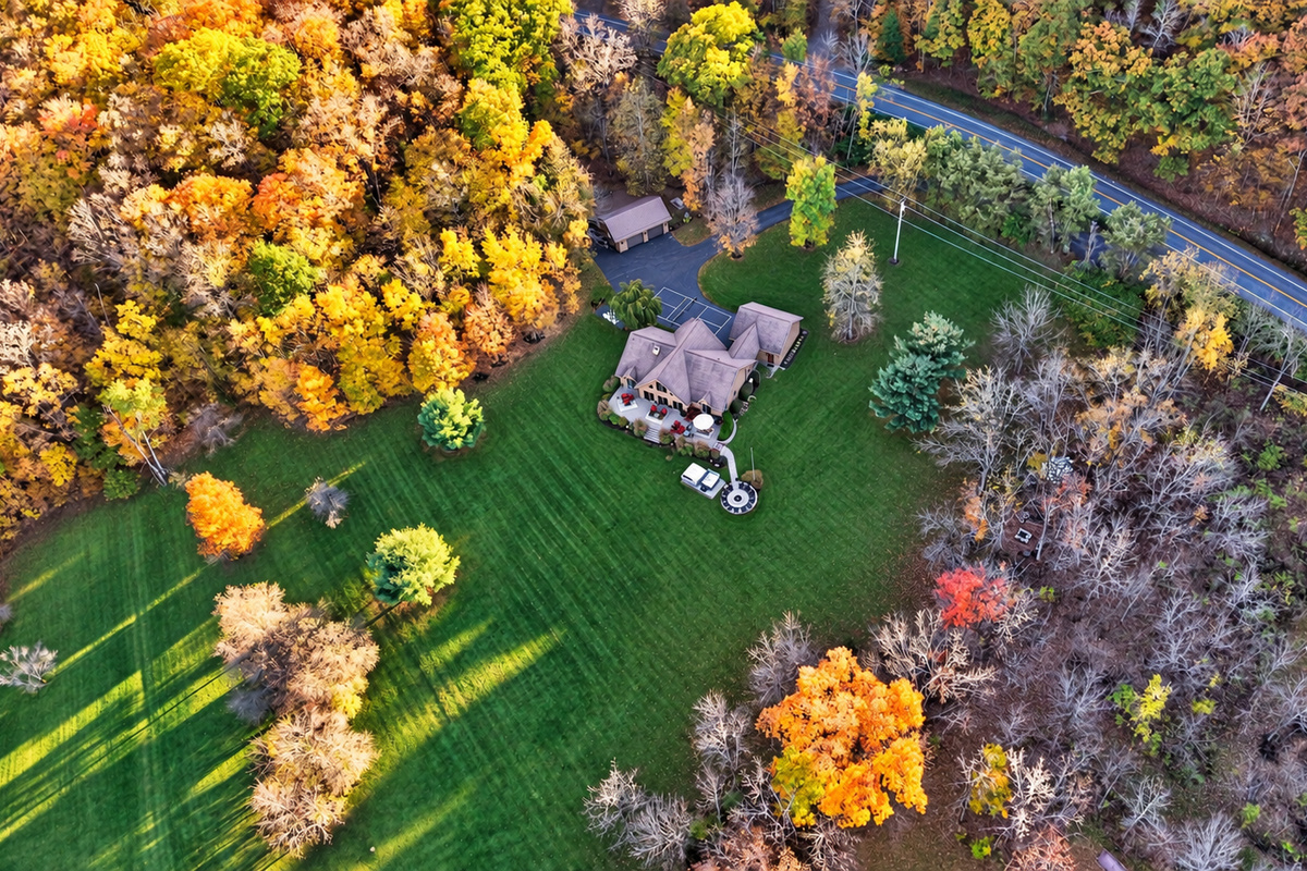 Aerial perspective of open lawn and mature trees