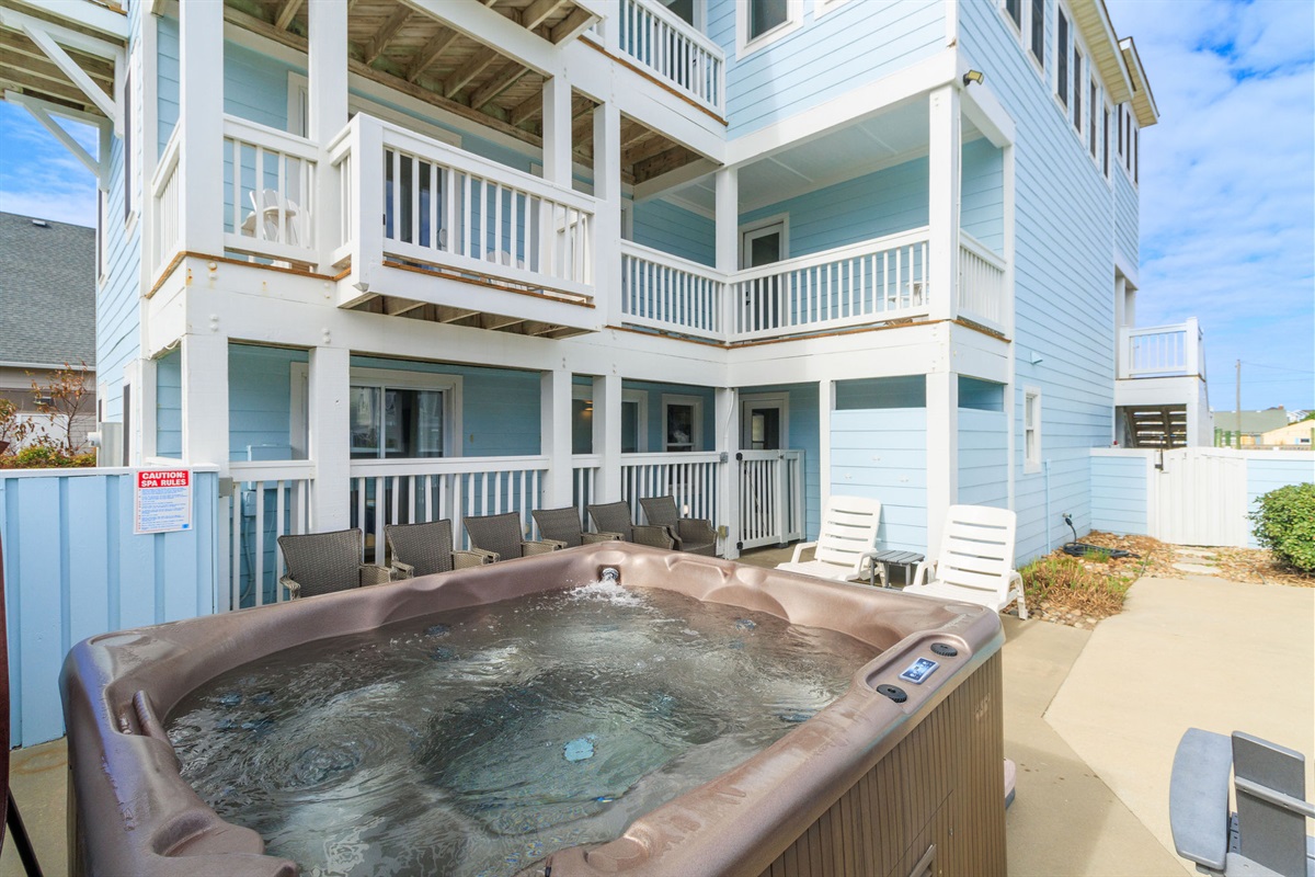 Relax in the hot tub or in one of the many chairs by the pool