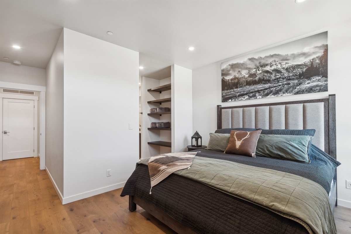 The master suite includes a luxury king mattress with top of the line linens, walk-in closet that leads to a stunning bathroom