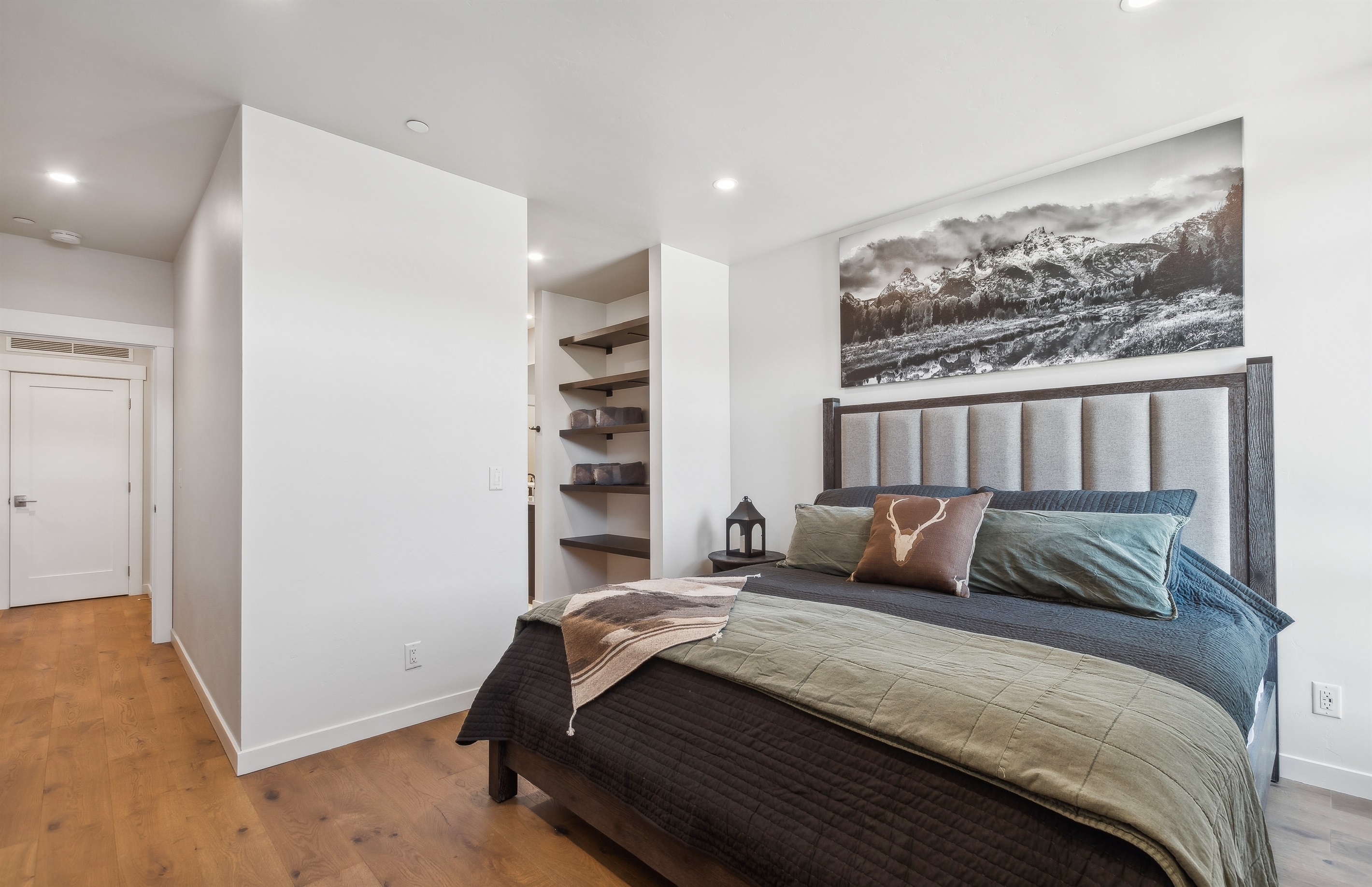 The master suite includes a luxury king mattress with top of the line linens, walk-in closet that leads to a stunning bathroom