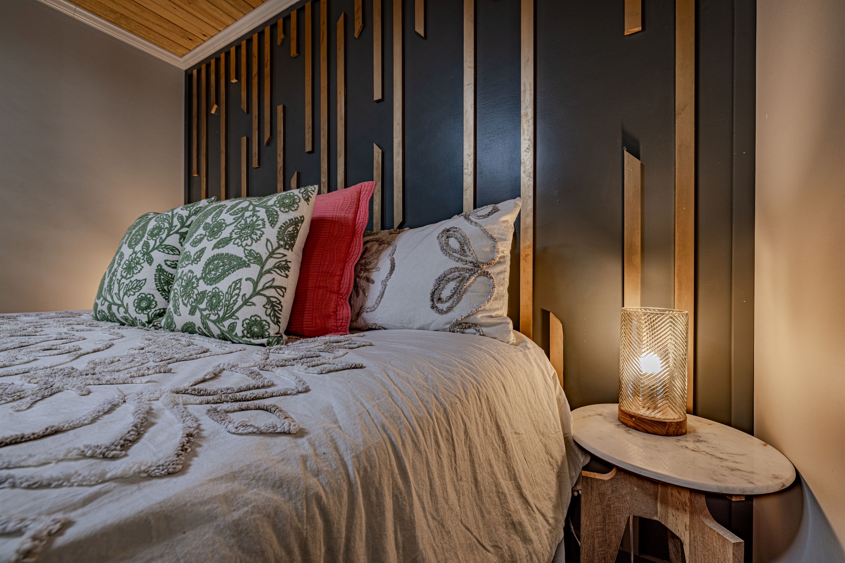 End your day in a space that feels like a boutique hotel. The thoughtful decor and artistic wall details make every night at the cabin feel special.