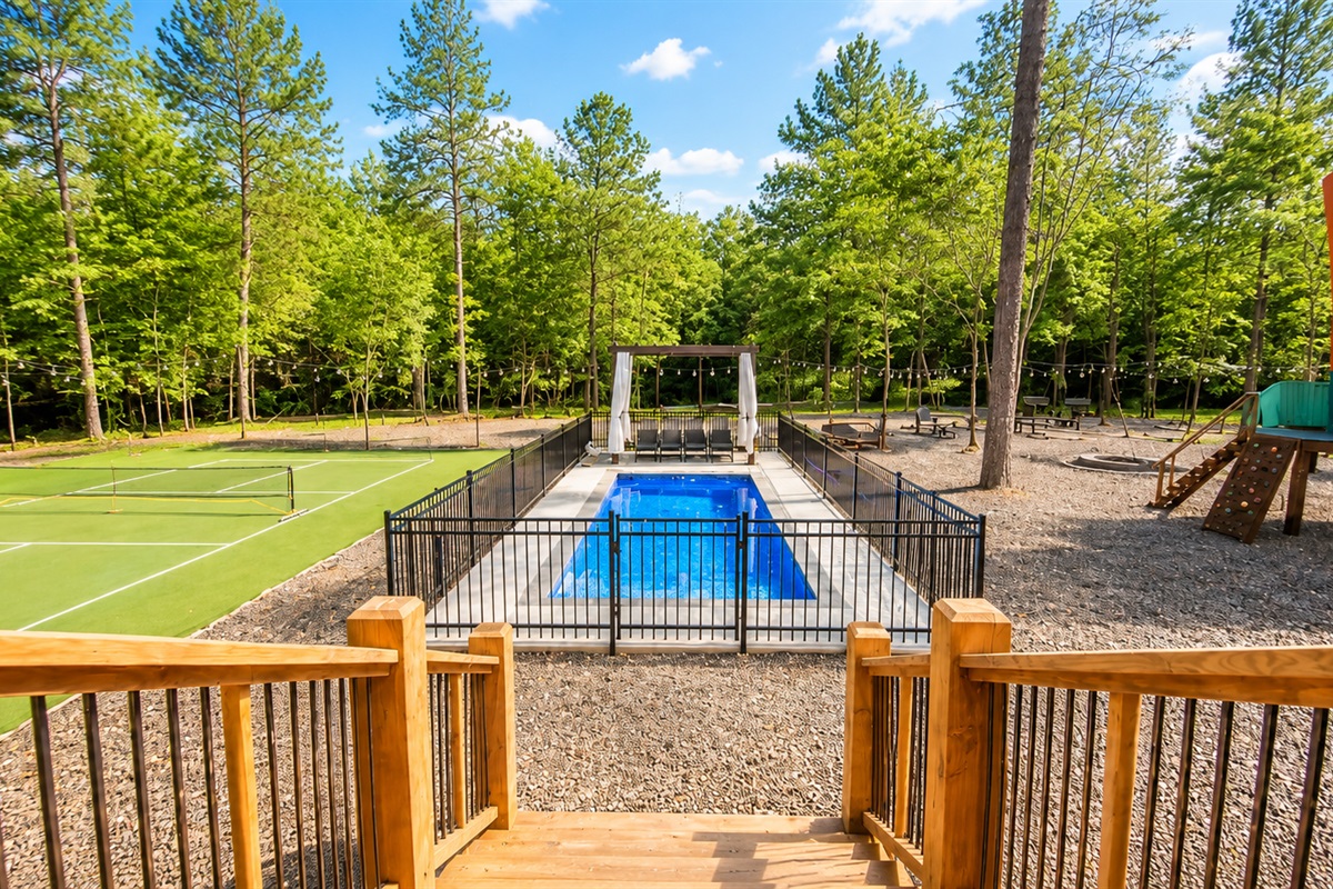 Outdoor Oasis: Dive into fun with a private pool, tennis courts, and playful surroundings!