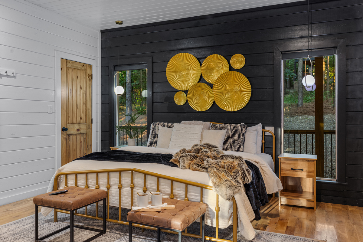 A relaxing private suite with a king bed and simple, comfortable design for a restful stay.
