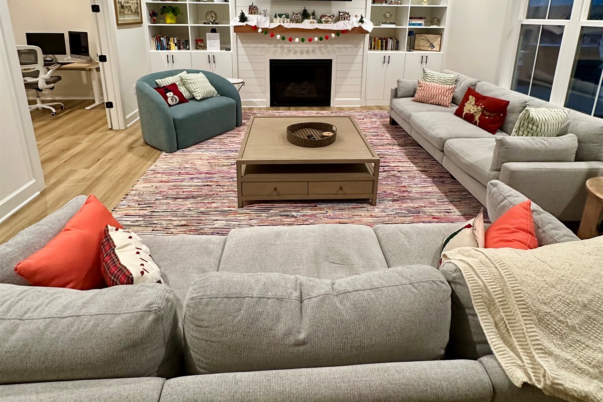 Gather in the beautifully decorated living room and relax by the fireplace while taking in peaceful lake views.