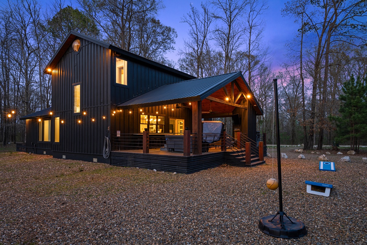 As the sun sets, the cabin lights up beautifully, creating a warm and welcoming glow that makes the whole place feel even more inviting.