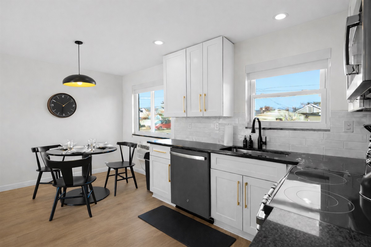 Bright, open kitchen and dining space with modern finishes, ample counter space, and natural light—perfect for cooking, dining, and everyday living.