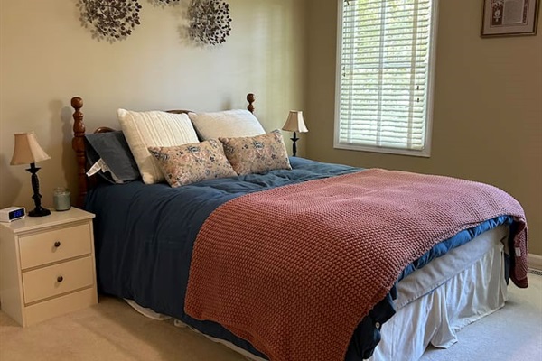 Bedroom #2. New Queen sized bed with mattress topper.