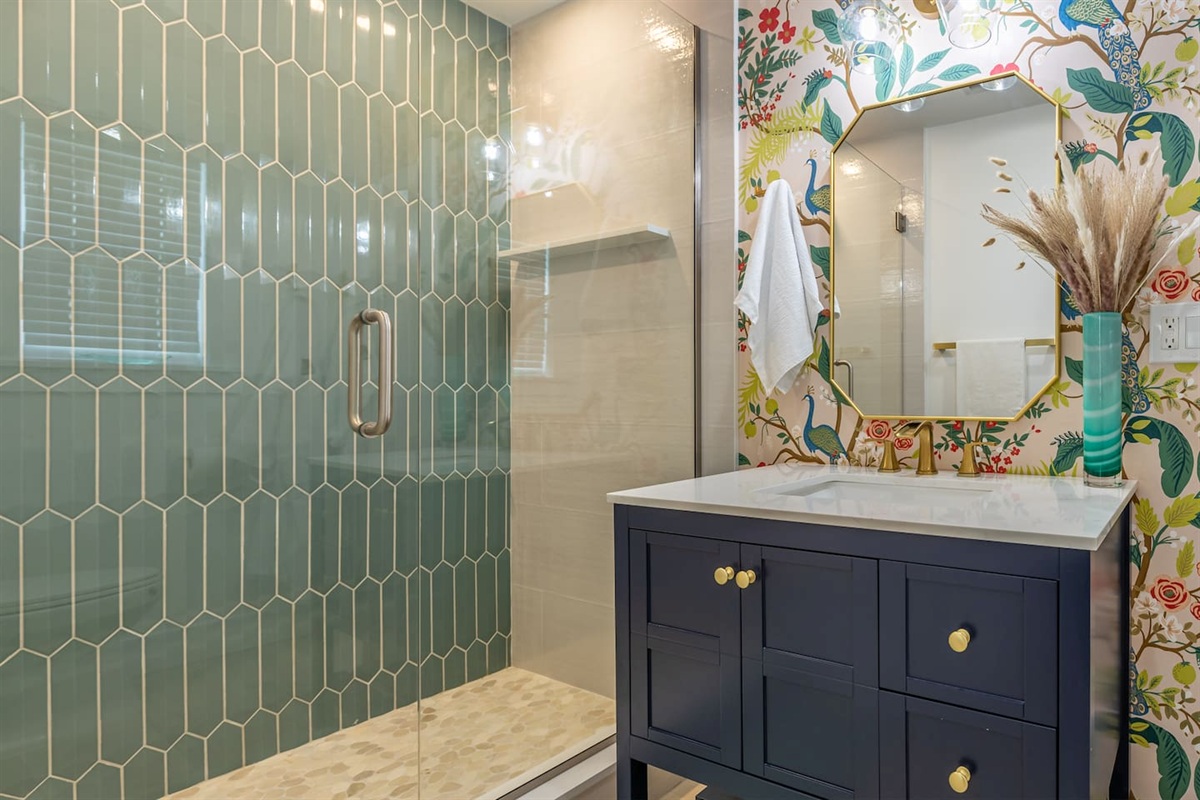 Bathroom Oasis: Refresh in style with vibrant decor and a luxurious rainfall shower experience!