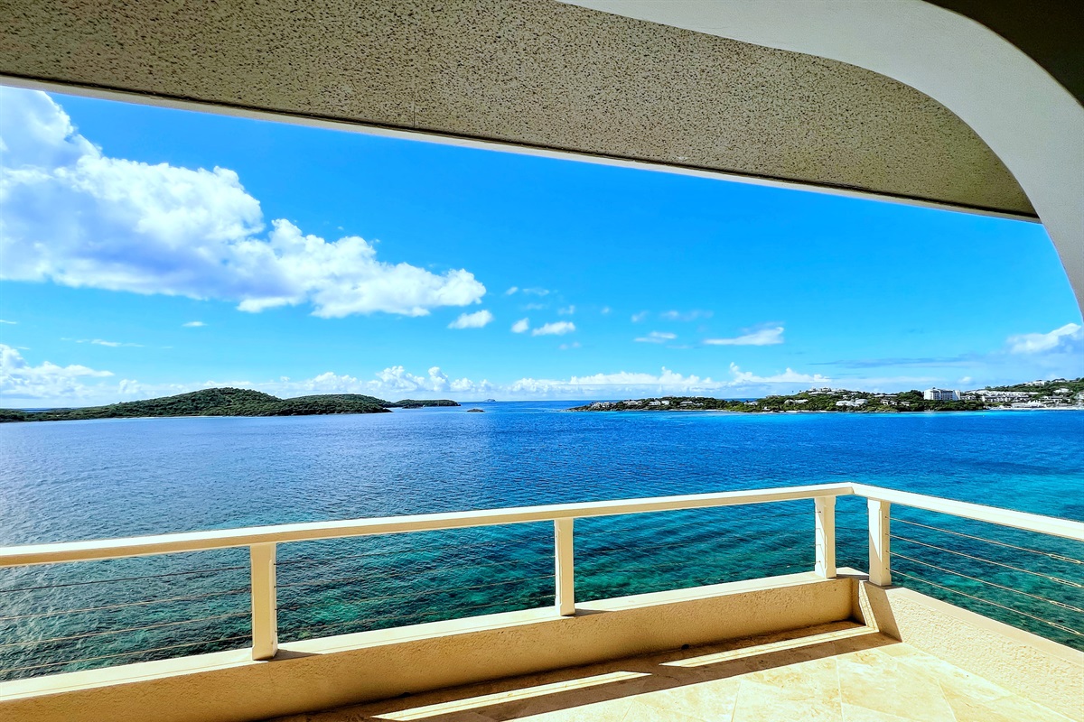 You have views of St. John to your left, Christmas Cove in front, and the Ritz to your right.