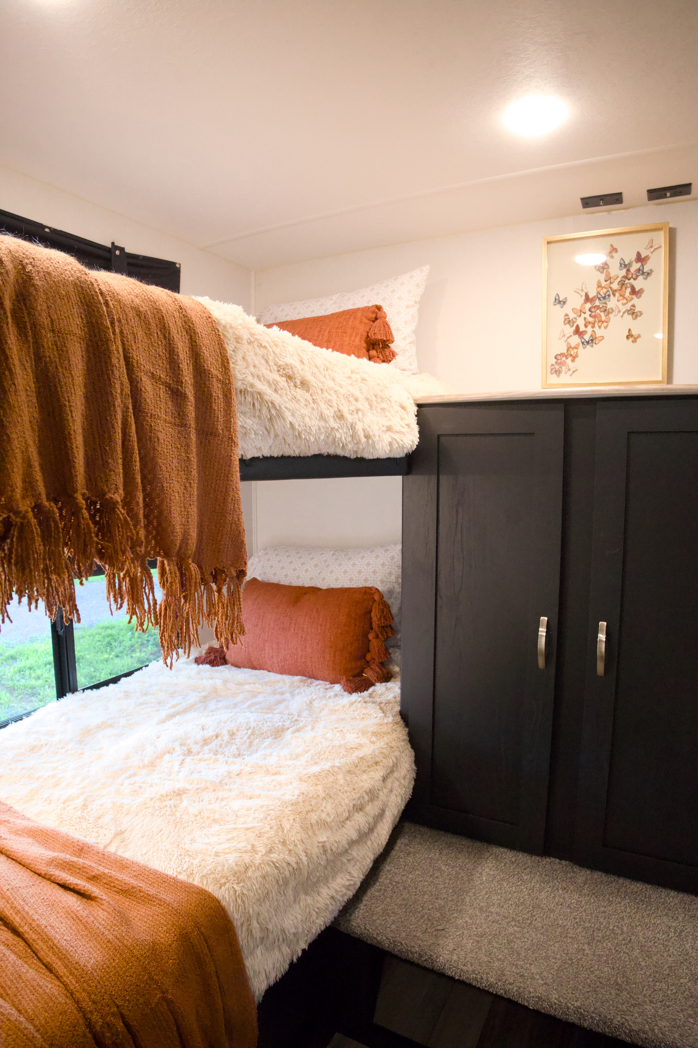 The bunk room has 4 bunks, each with their own window. 2 of the beds are 26.5" wide, so there's not much room for moving around.