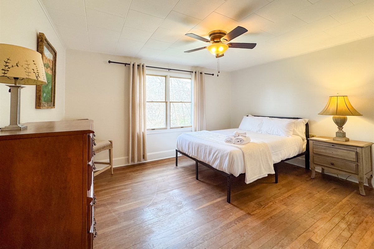 Our guest bedroom features a queen size bed with comfy, high thread count linens and shredded bamboo pillows! The beds are cooling memory foam with a medium firm feel.