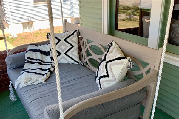 Imagine watching golfers from the view of your porch swing!