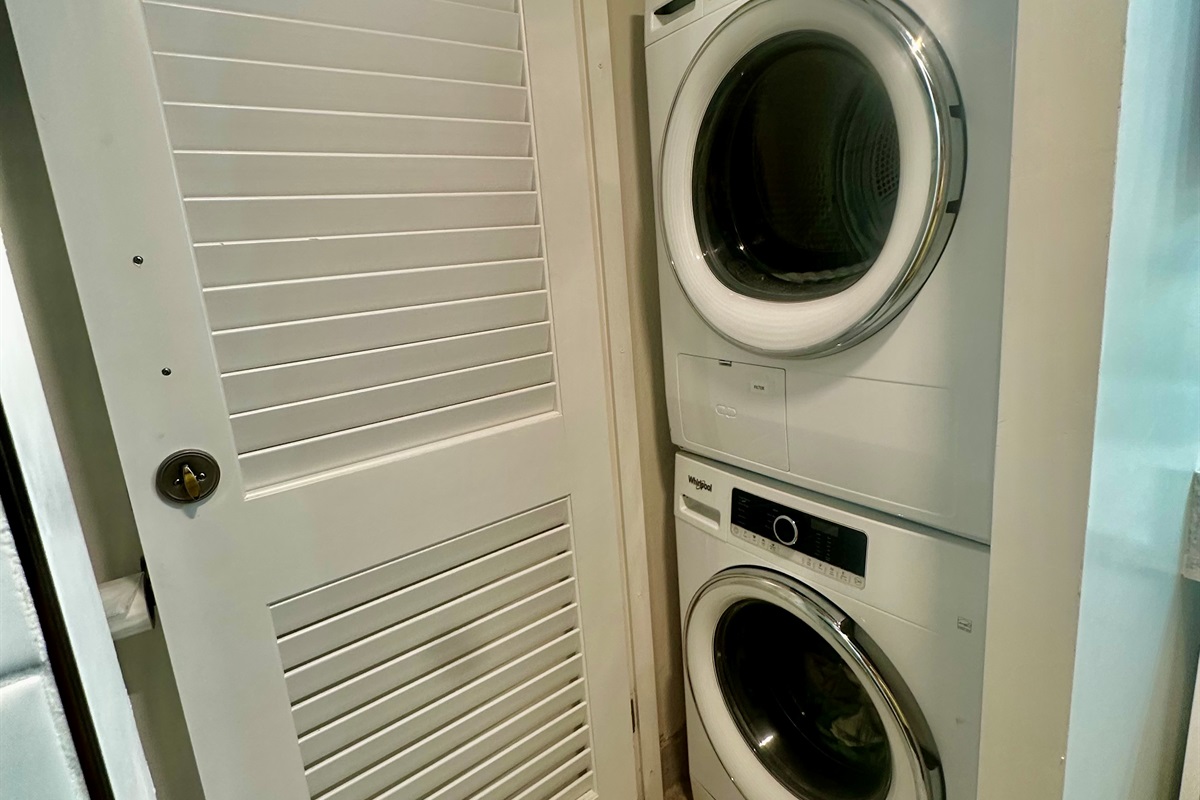 The stacked washer and dryer are located in the first floor bathroom