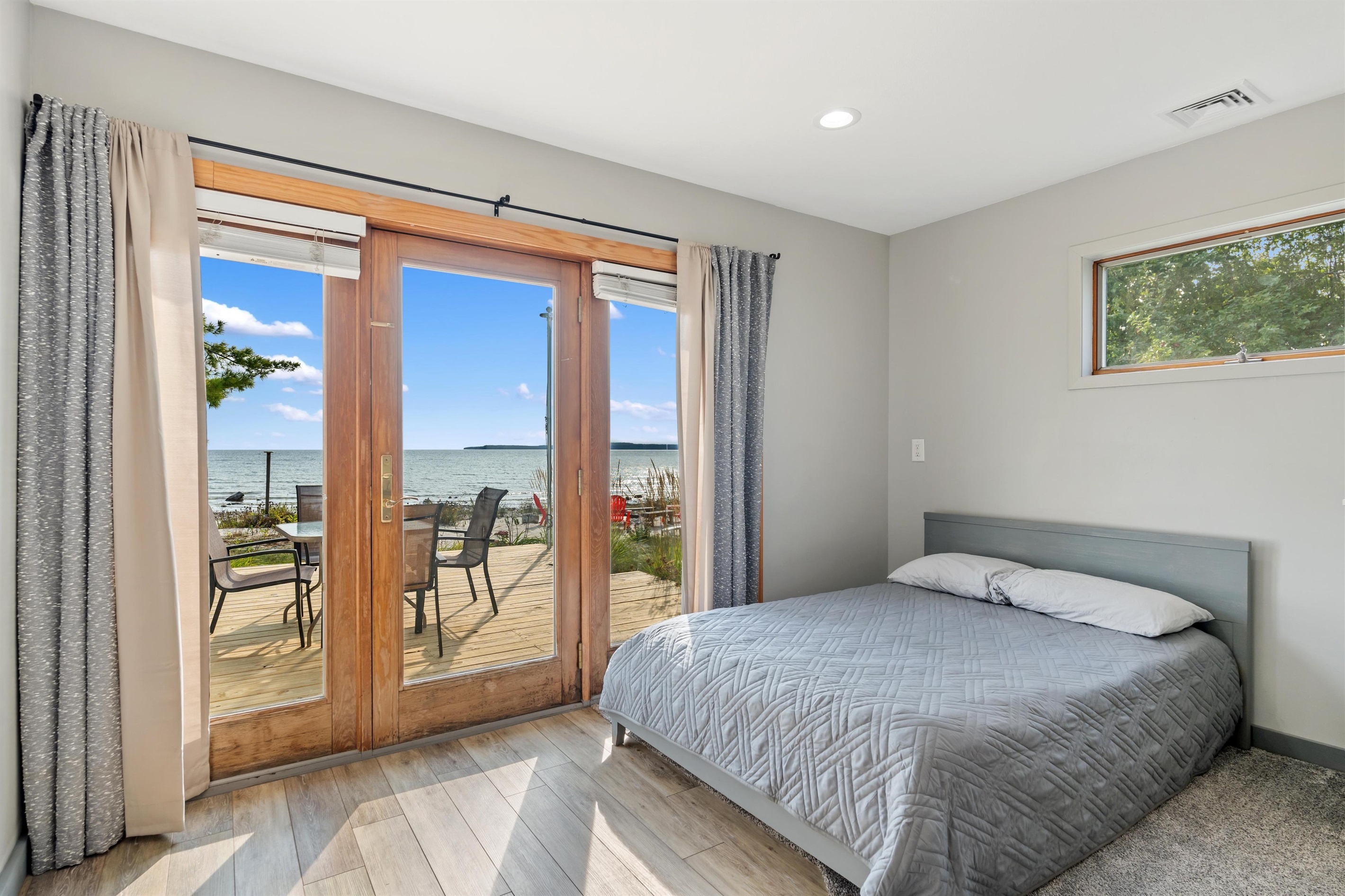 Gorgeous Views through the Primary suite French doors and Queen sized bed