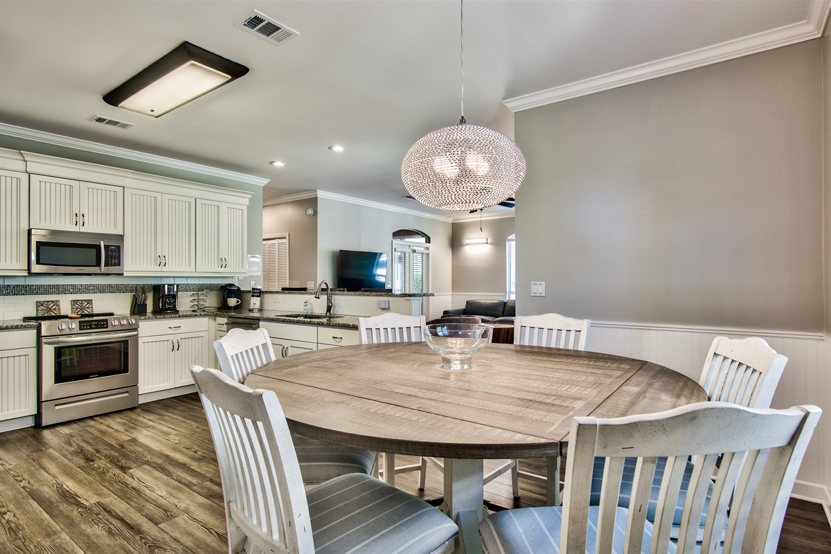 Dining area with seating for six and coastal‑inspired décor