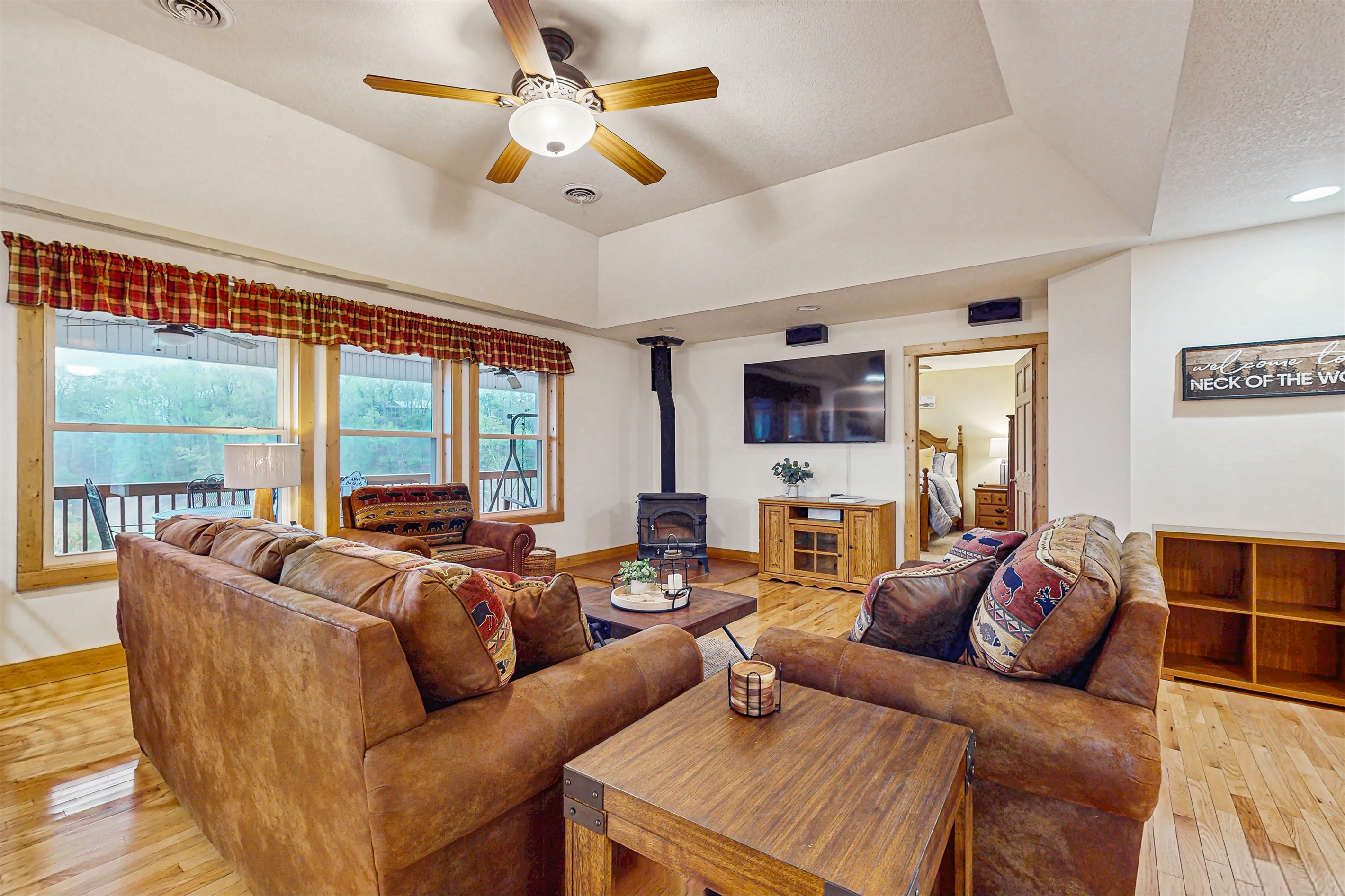 Cozy living room with seating overlooking the lake with fireplace for cozy evenings