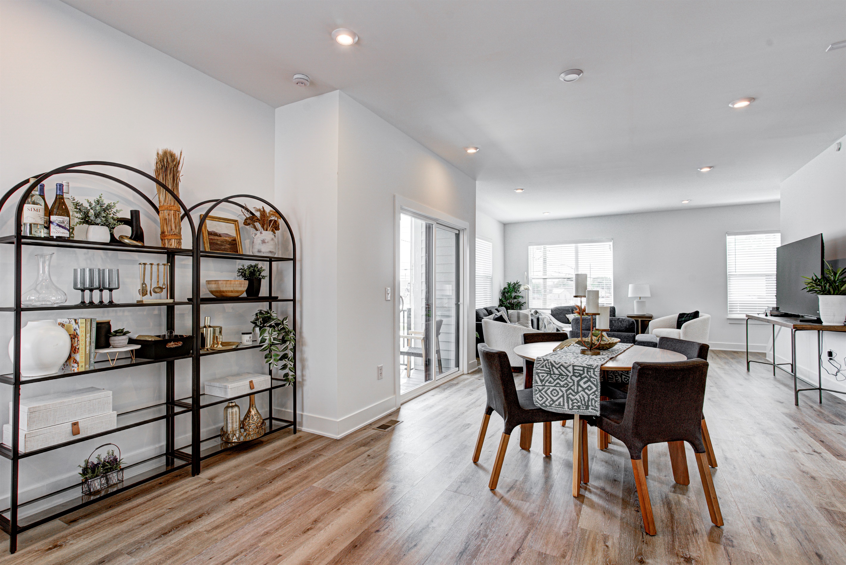 Enjoy a designed open-concept space with a modern kitchen equipped with quartz countertops, stainless steel appliances, and all essentials for home cooking. 