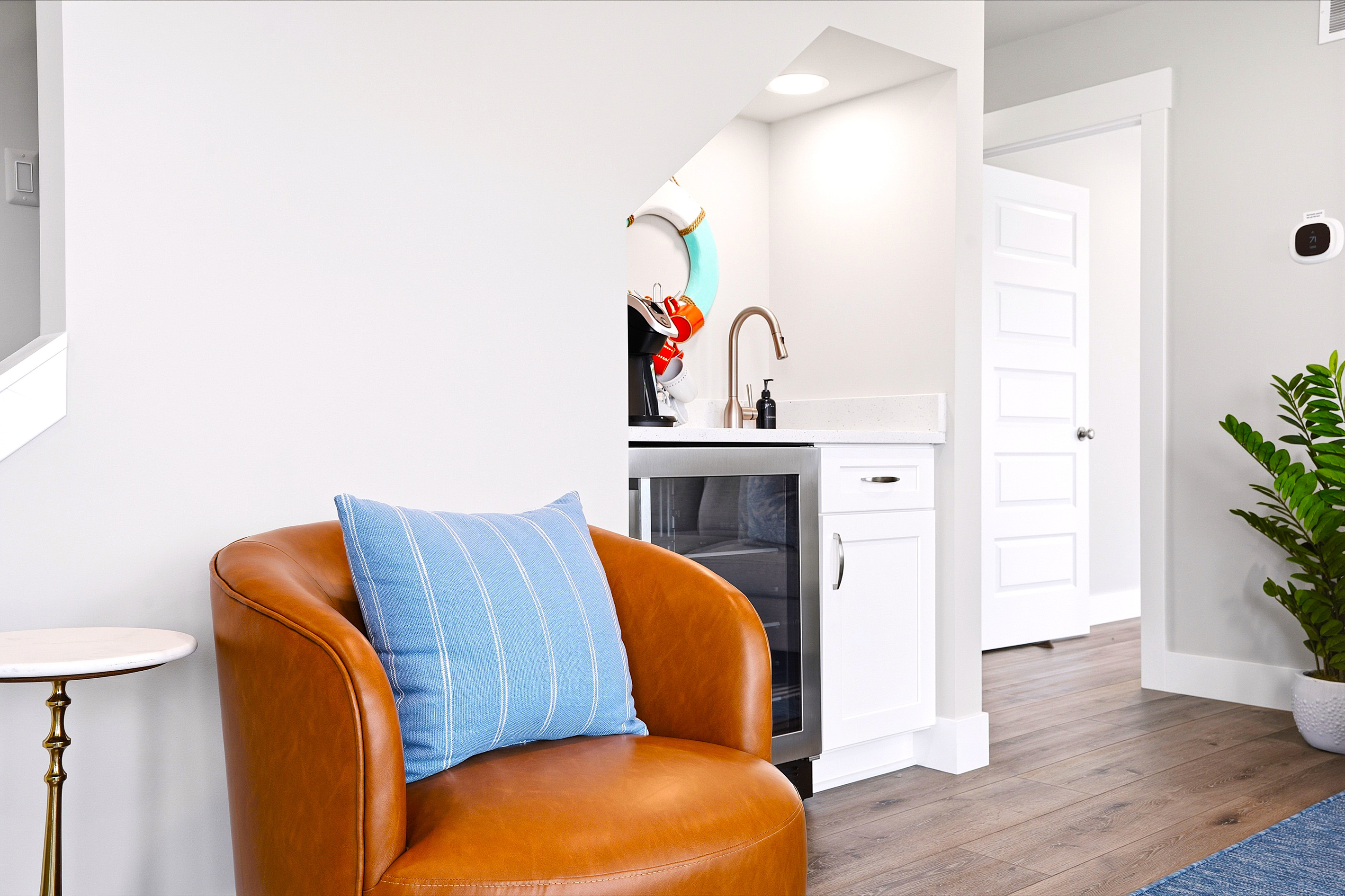 Enjoy the convenience of a built-in beverage station with a sink, drink fridge, Keurig, and traditional coffee maker—perfect for morning coffee or evening refreshments without heading downstairs.