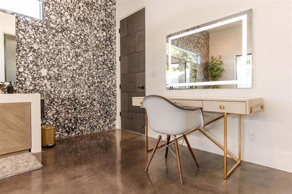 Makeup vanity with lighted mirror