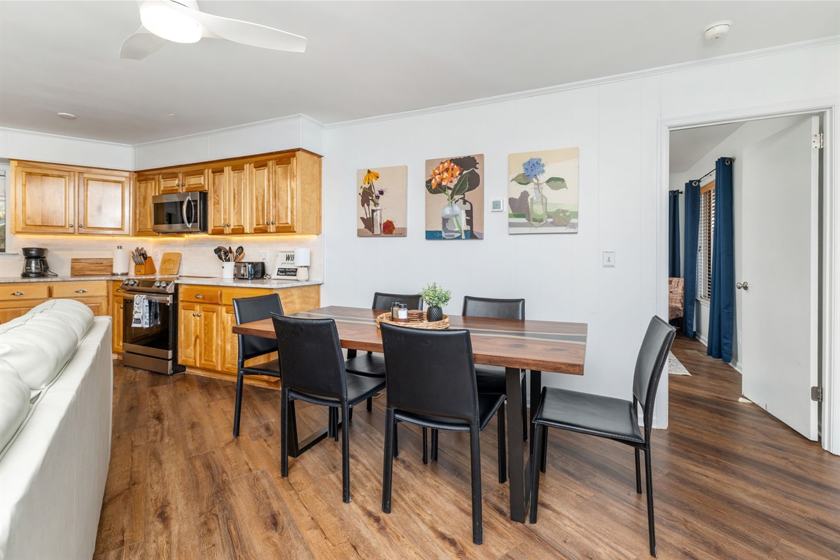 Dining Room: Gather around the stylish table for meals and laughter in a vibrant setting!