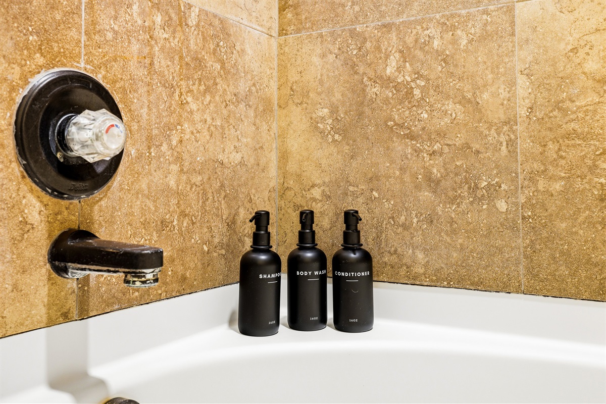Both bathrooms stocked with full-size shampoo, body wash, and conditioner — no need to pack toiletries. Hotel-quality essentials provided for every guest.