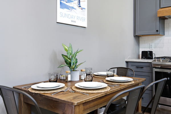 Share meals together around the dining table in a cozy, welcoming setting.
