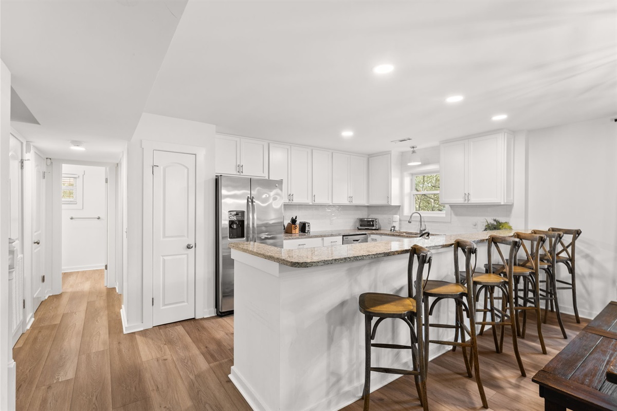 Side A: Sleek 2nd-floor kitchen and dining area—perfect for large family meals.