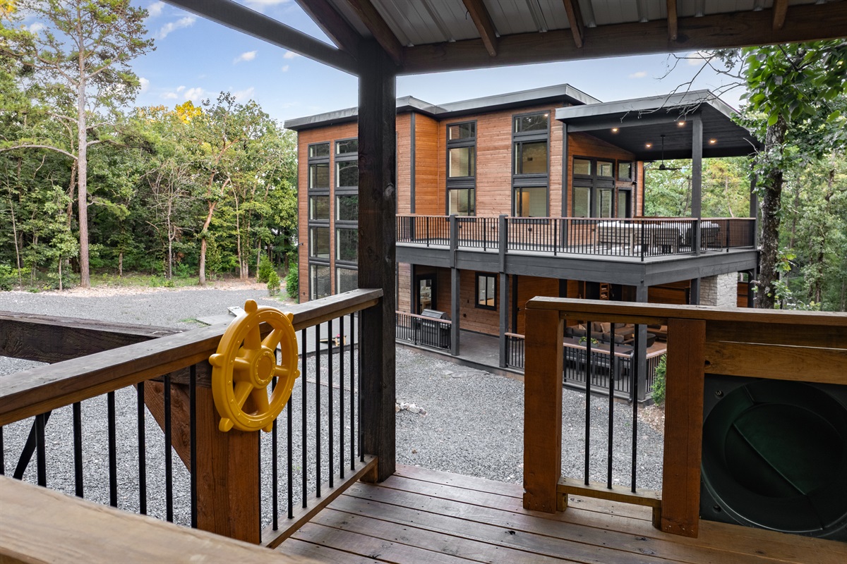 Kids love it in their large, personal tree house. Complete with slide, swings, and climbing wall