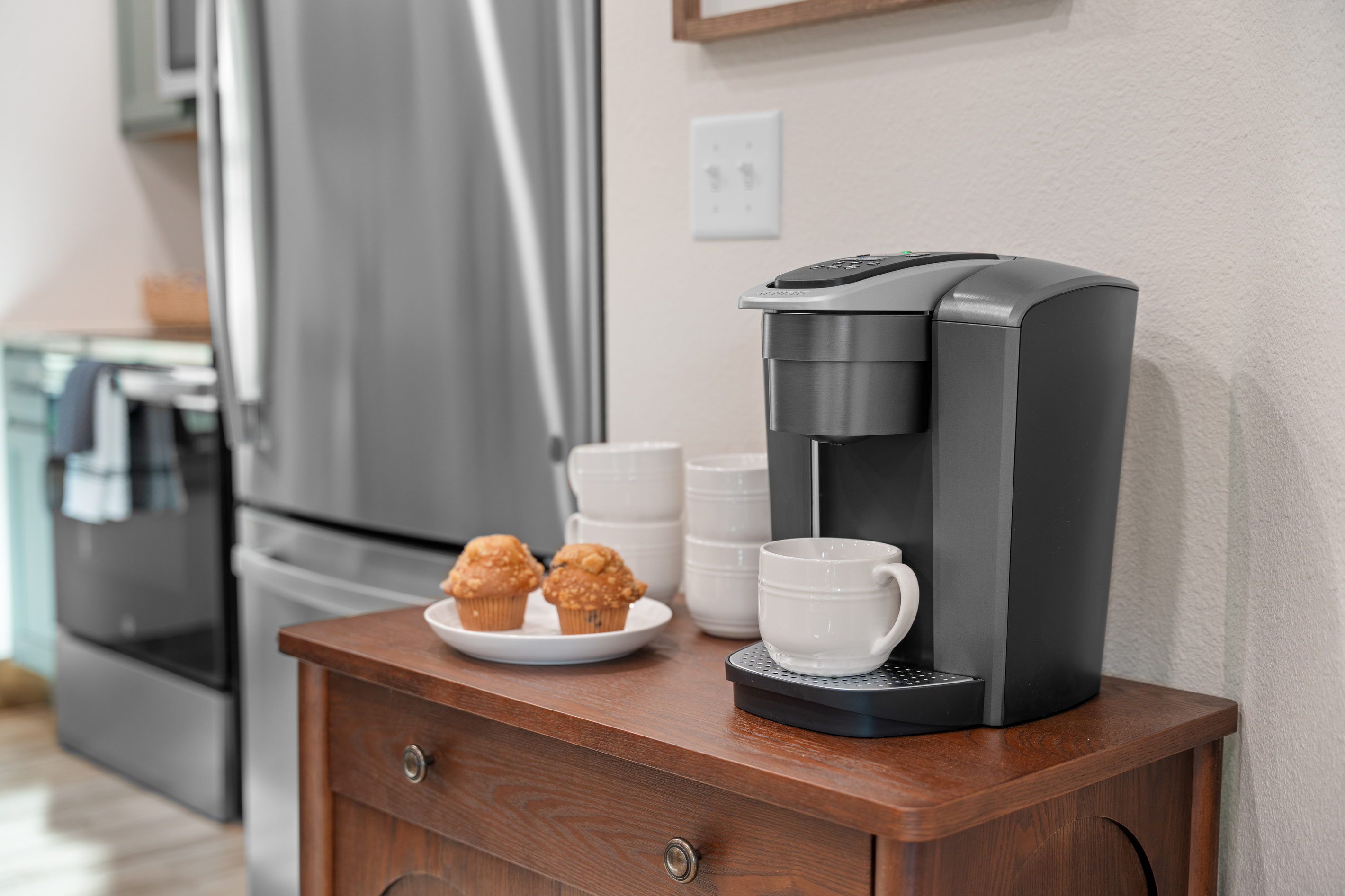 Start the day off right with a cup of coffee from the coffee bar waiting by the fridge.