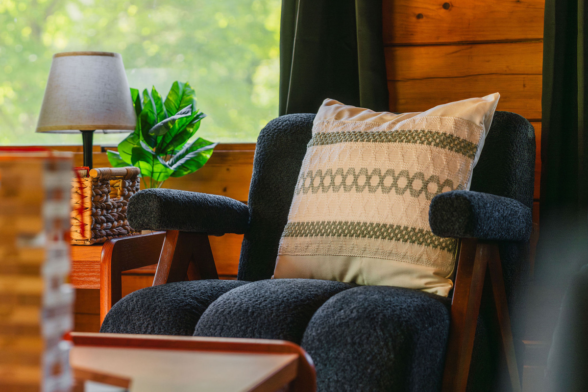 📖 Cozy reading chair tucked into a peaceful spot.