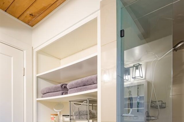 Second bath storage area, hairdryer, makeup mirror.