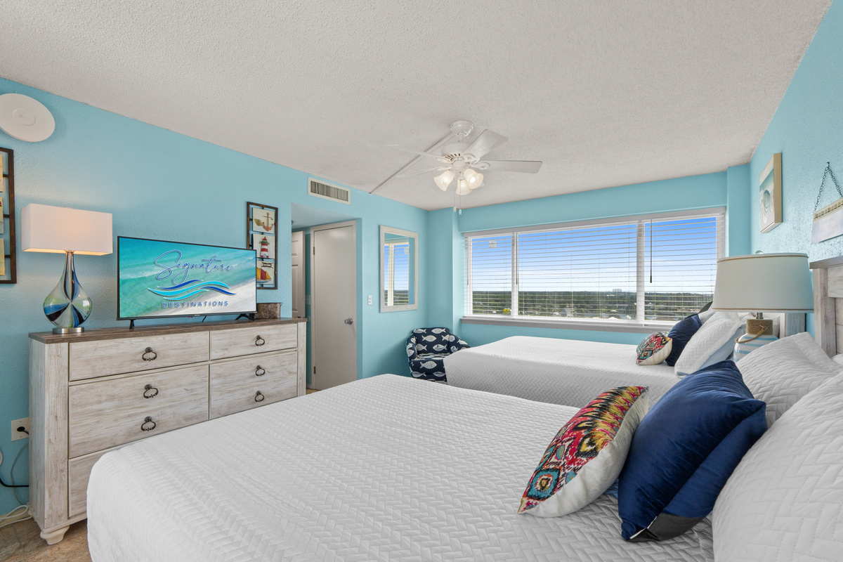 Bedroom 3 with two queen beds and a small private balcony