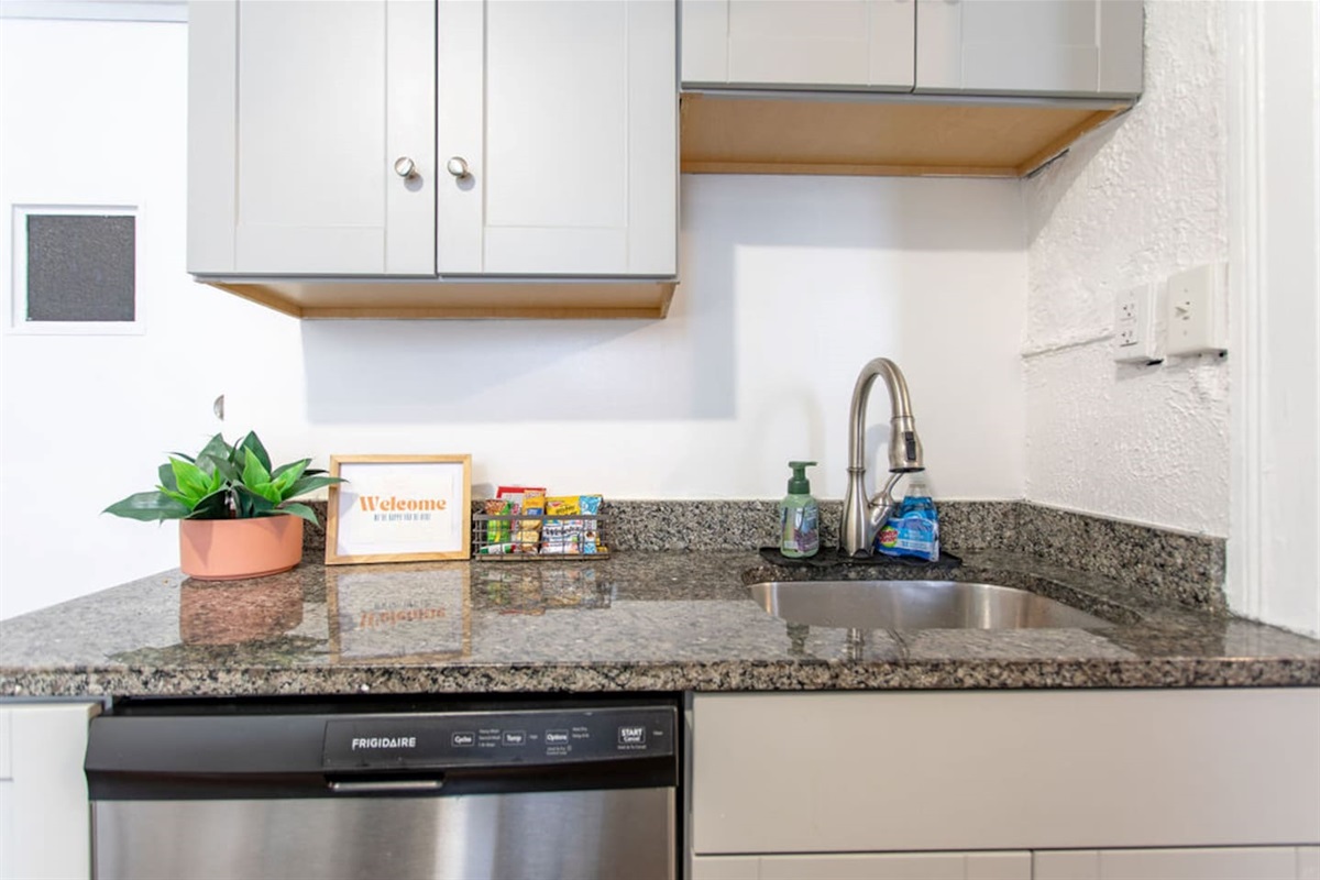 Full kitchen featuring sleek, modern stainless steel appliances for a stylish and functional cooking space.
