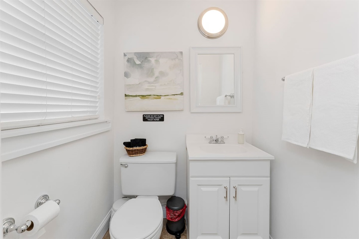 Clean private ensuite w/ simple, fresh touches