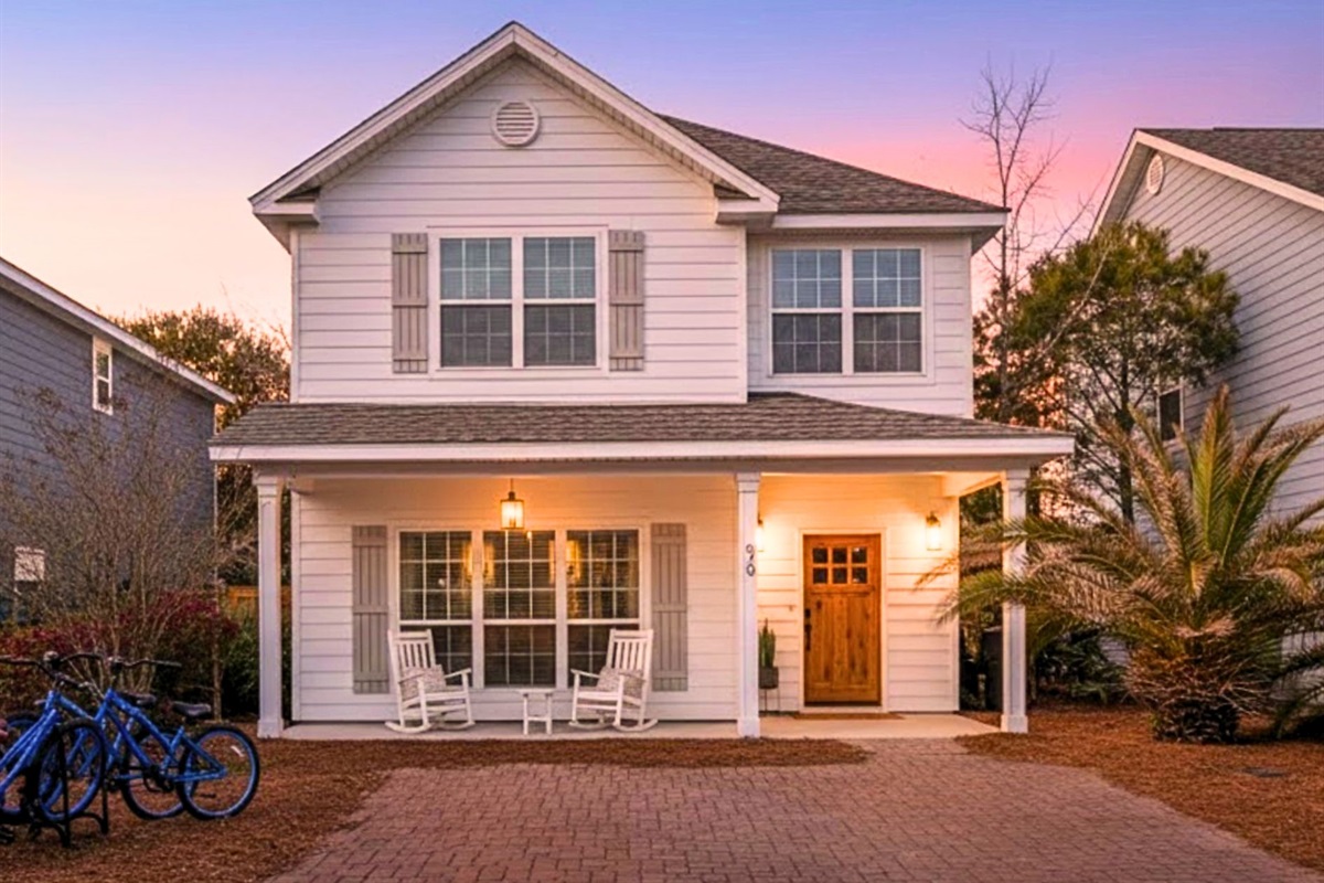 Front Exterior: Welcome to your newly painted coastal retreat, featuring secure on-site parking for two full-sized vehicles.