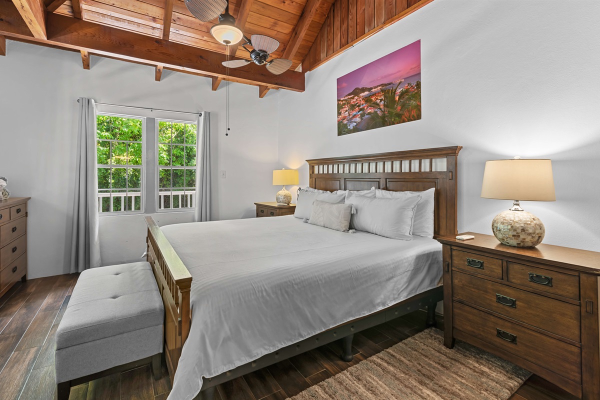 Spacious bedroom with a comfortable king bed.