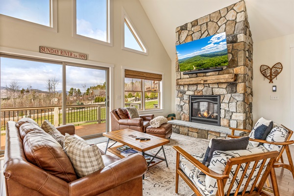 Relax on the open-concept main floor and enjoy mountain views, a fireplace, and a big-screen TV.