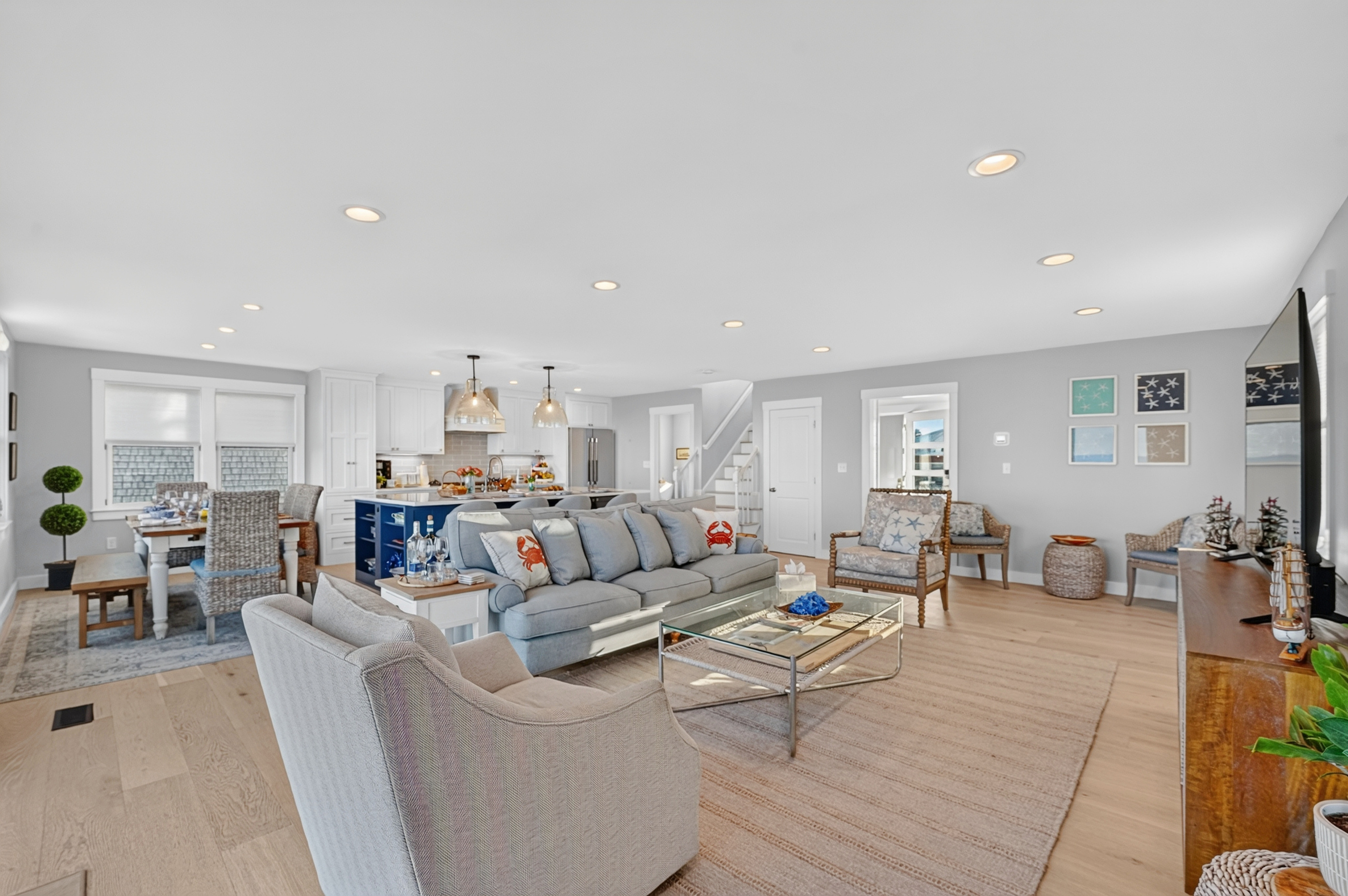 Beautiful great room with comfortable seating, abundant natural light, and ocean views