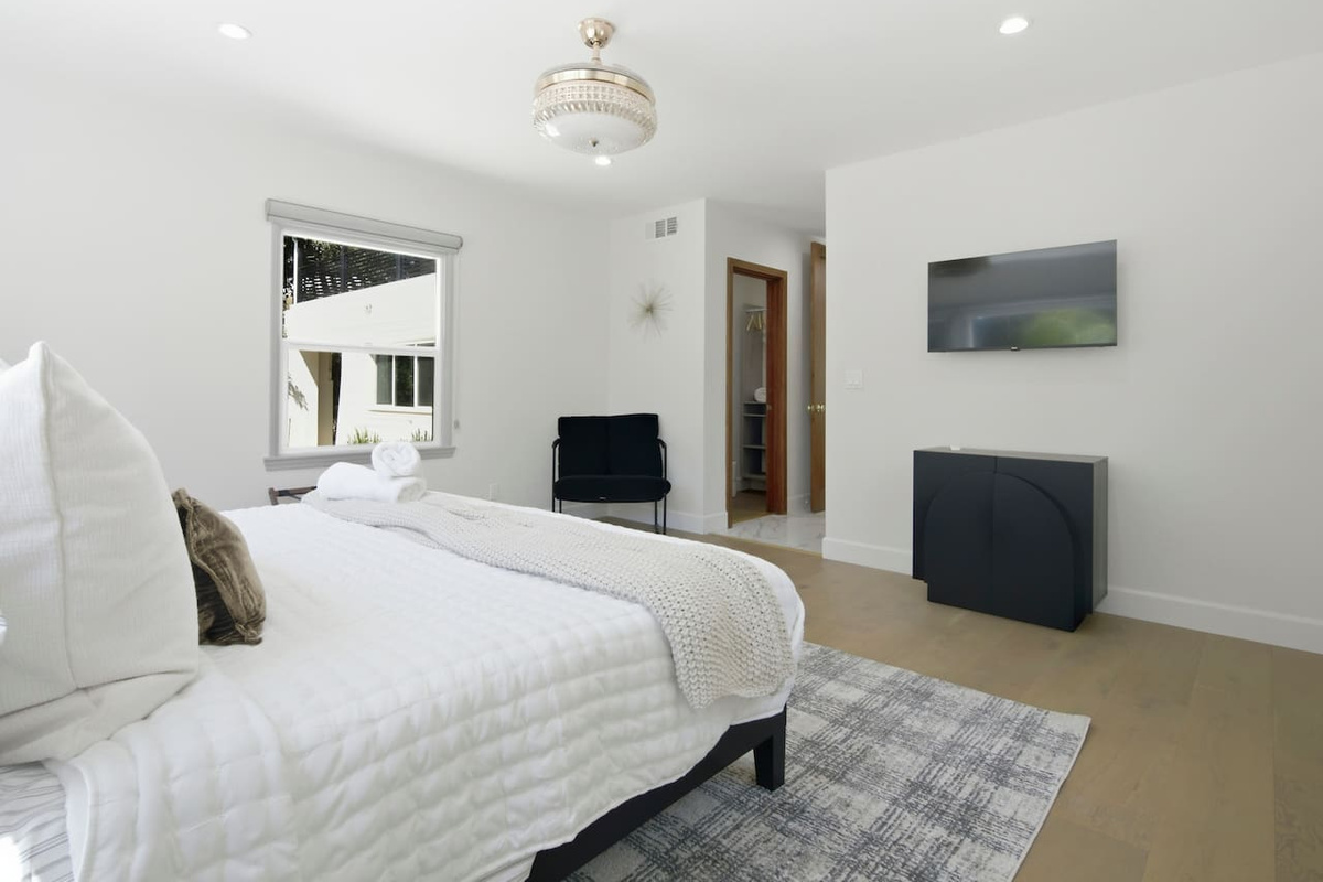 A picture-perfect bedroom with cozy comforts and stylish touches for a memorable getaway.