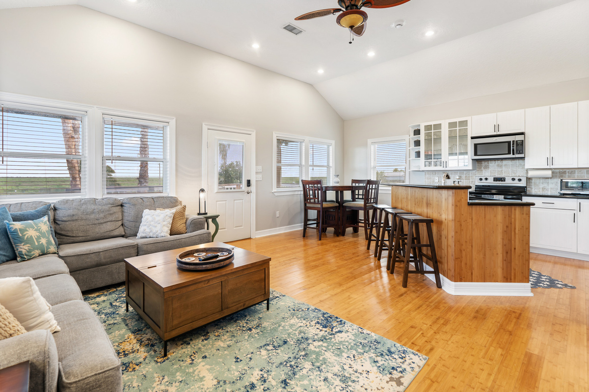View of open concept living, kitchen and dining room.