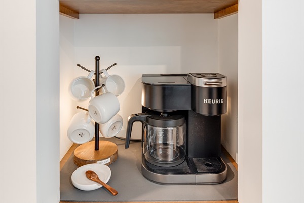 Enjoy a Keurig that brews single pods & full pots, perfect for solo sips or group mornings. Guests enjoy a starter set of complimentary coffee, tea, & flavored syrups to craft the perfect cup.