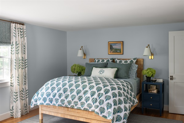 Comfortable queen bed in Bedroom 1, perfect for a good night’s sleep.