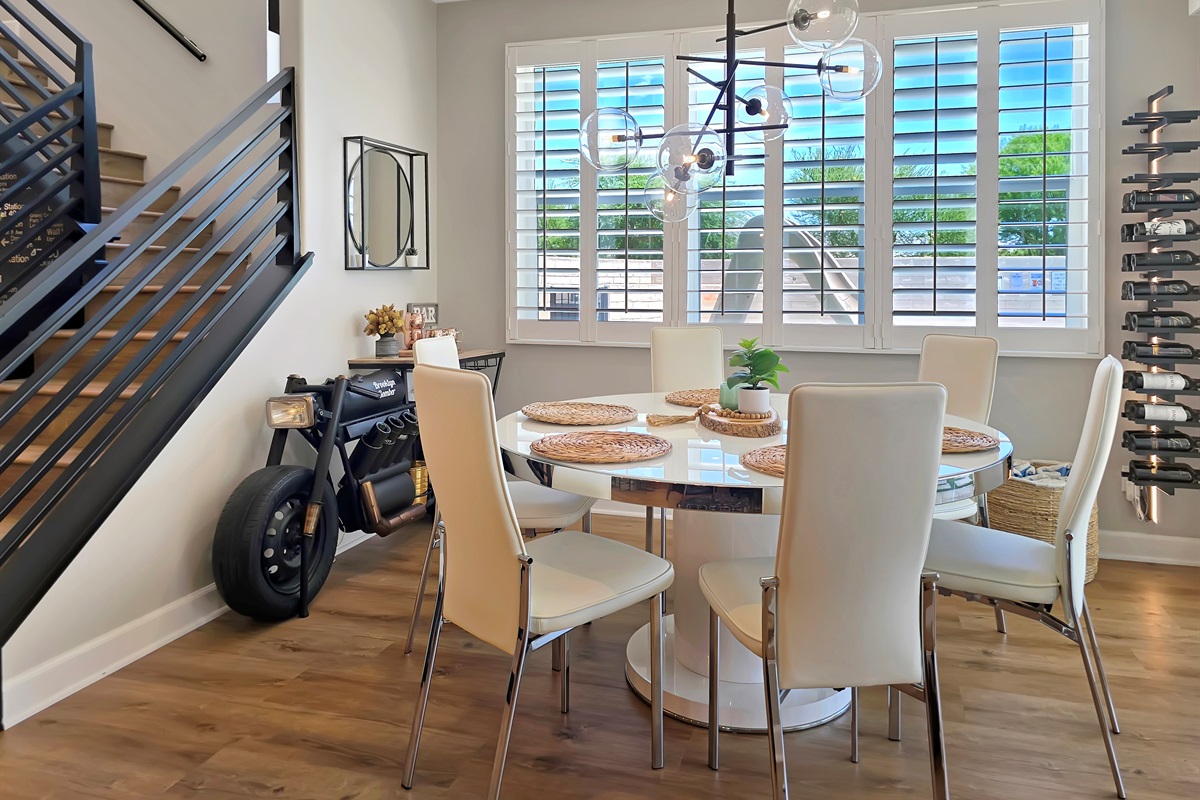 The dining chairs tilt back to encourage supreme relaxation and the chandelier by Arhaus commands attention of its own! Experience dining at home like never before. 